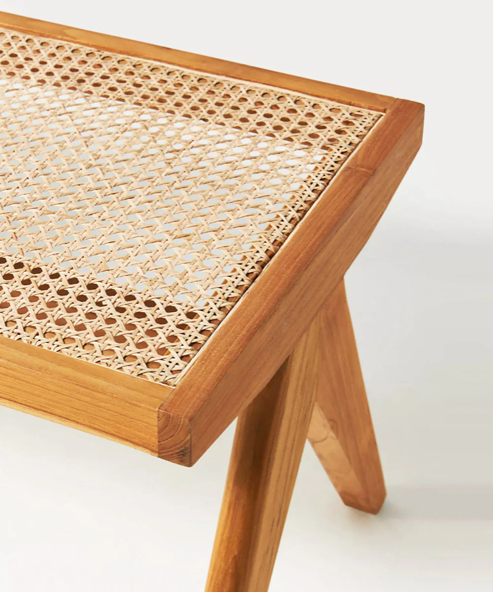 Cane bench with detailed top view of rattan weaving and teak finish, designed by Aesthetic Craft. Cane bench with detailed top view of rattan weaving and teak finish, designed by Aesthetic Craft.