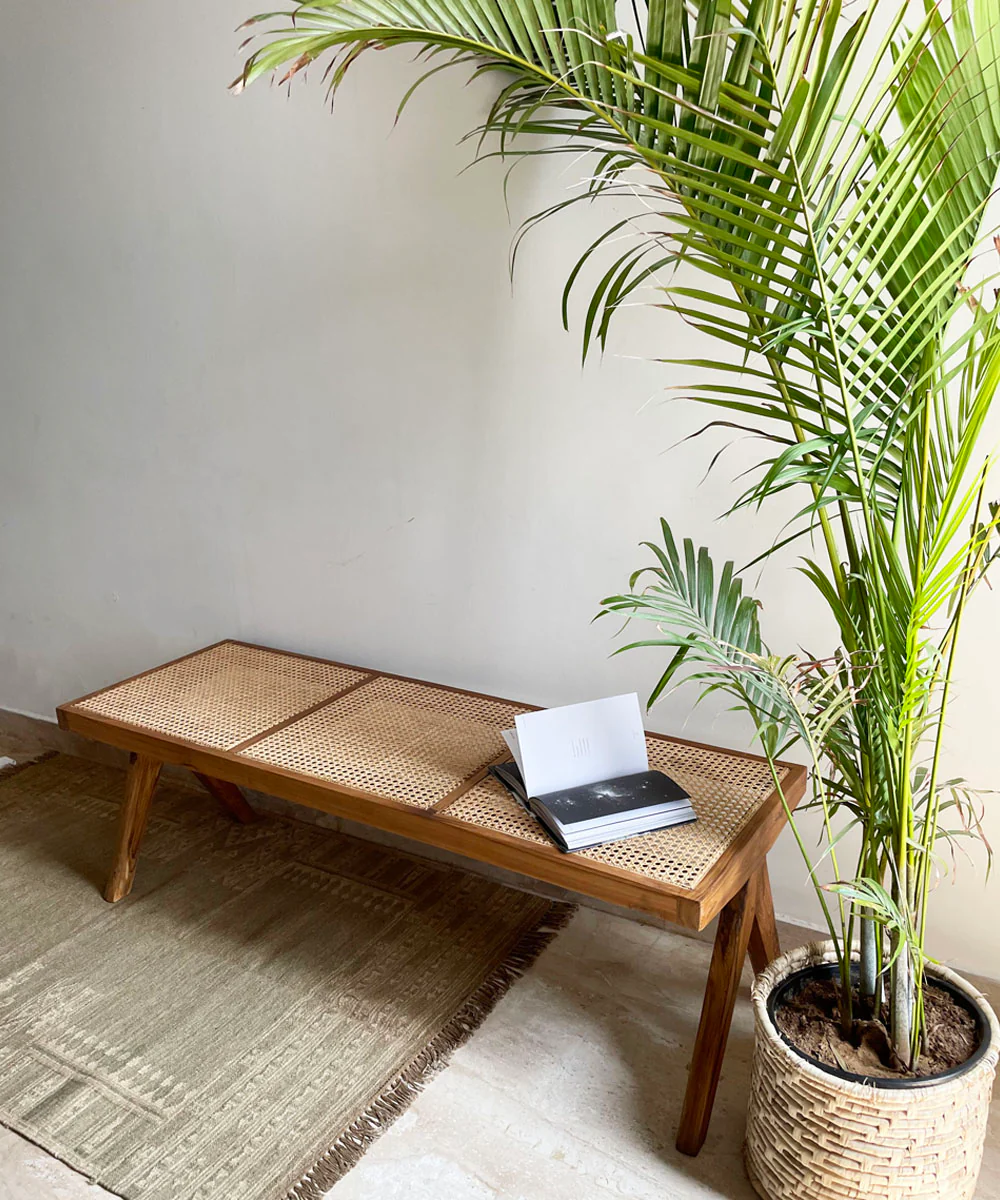 Cane bench in teak finish with rattan weaving, crafted from Sheesham wood by Aesthetic Craft Cane bench in teak finish with rattan weaving, crafted from Sheesham wood by Aesthetic Craft
