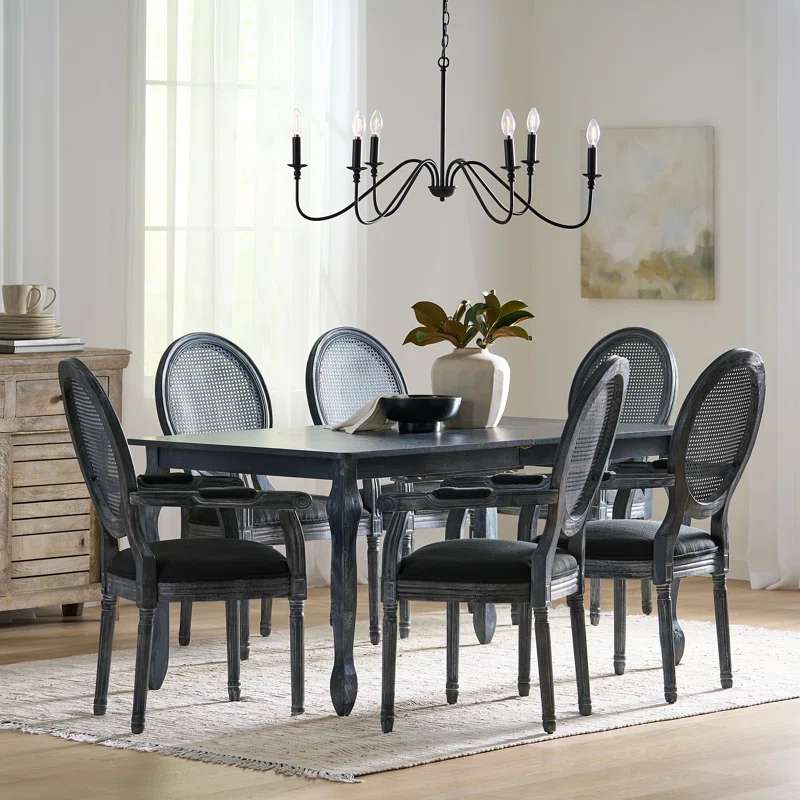 Black 6-person dining table set with wide armchairs and modern styling Aeshteticcraft Black 6-person dining table set with wide armchairs and modern styling Aeshteticcraft