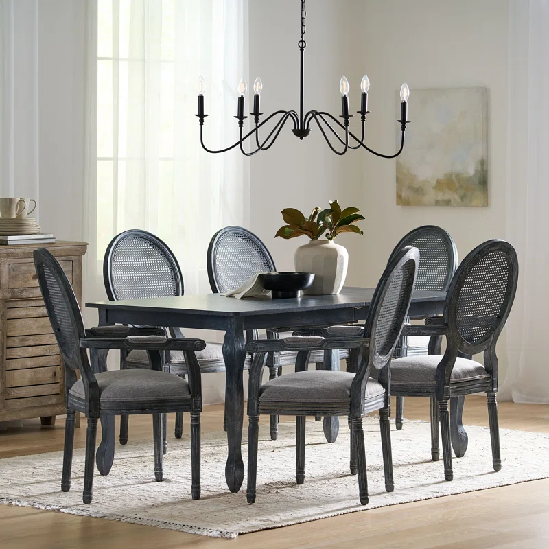 Black 6-person dining table set with wide armchairs and modern styling Aeshteticcraft