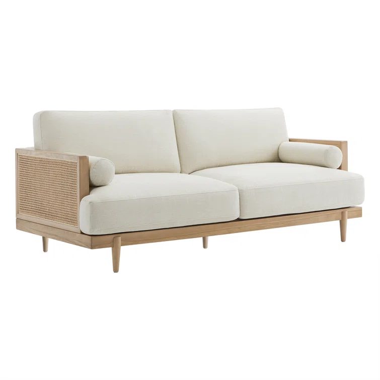 Natural mango wood and cane upholstered sofa with wide cushioned seat Aesthetic craft Natural mango wood and cane upholstered sofa with wide cushioned seat Aesthetic craft