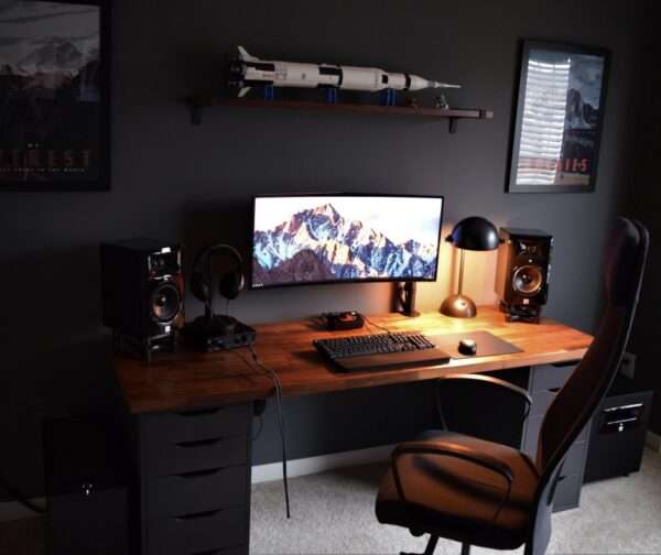 Aesthetic craft Modern gaming desk with dark brown wooden top and black drawer units, dual monitor setup shown.