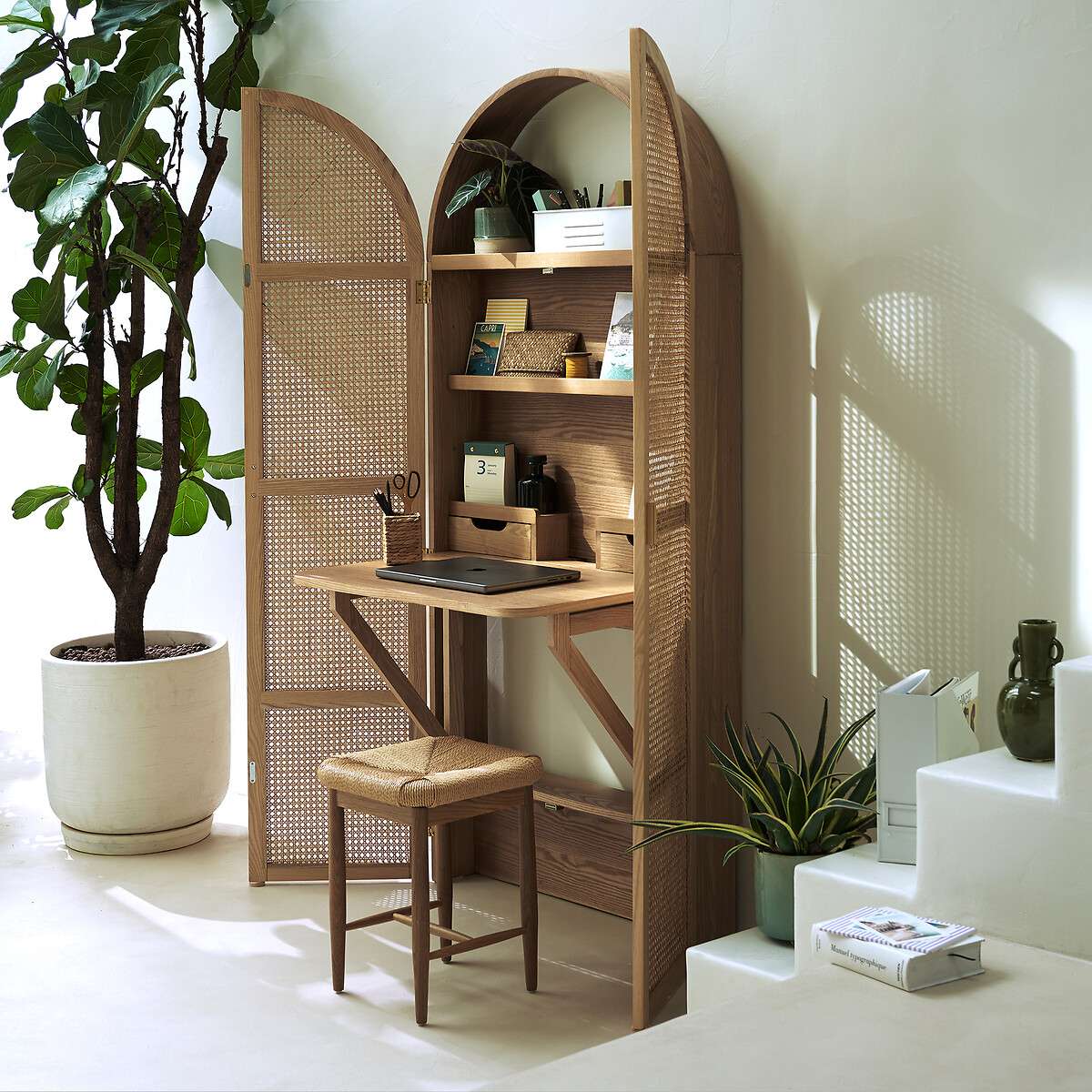 Foldable oak and rattan cabinet desk with brass handles, closed against a wall Aeshtetic craft