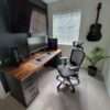 Aesthetic craft Modern gaming desk with dark brown wooden top and black drawer units, dual monitor setup shown.