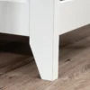 Aesthetic craft L-shaped executive desk with white base, wood top, drawers and shelves for home office use.
