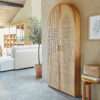Foldable oak and rattan cabinet desk with brass handles, closed against a wall Aeshtetic craft