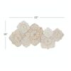 Hand-carved wood wall panel with white floral design, hanging above a sofa in a living room Aesthetic craft