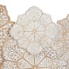Hand-carved wood wall panel with white floral design, hanging above a sofa in a living room Aesthetic craft