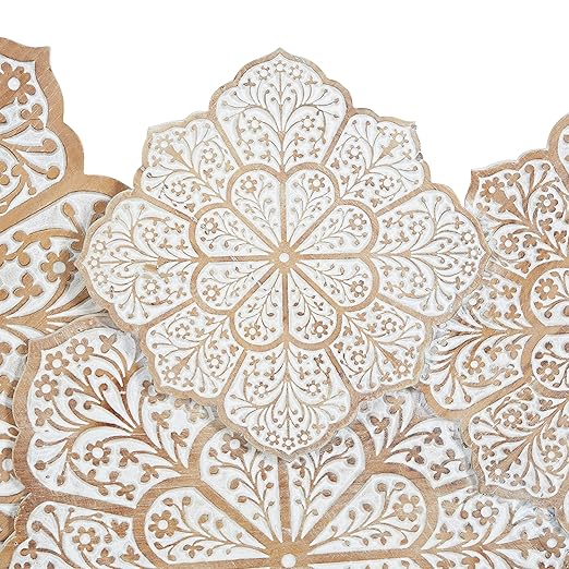 Hand-carved wood wall panel with white floral design, hanging above a sofa in a living room Aesthetic craft