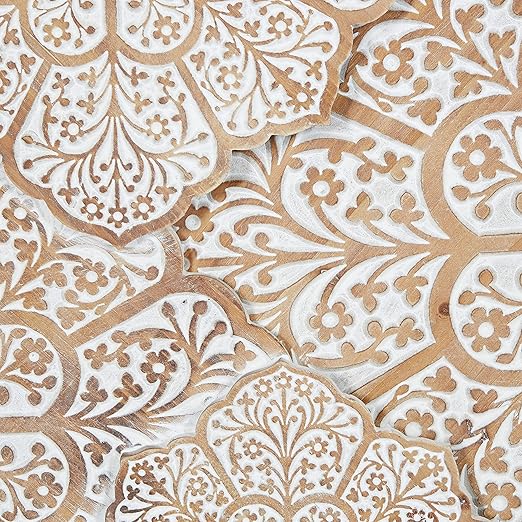 Hand-carved wood wall panel with white floral design, hanging above a sofa in a living room Aesthetic craft