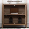 Tall wooden rattan bookshelf with cabinet doors, styled in a modern living room. Aesthetic craft