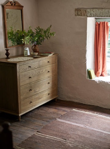 chest of drawers in natural brown finish with 5 spacious drawers
