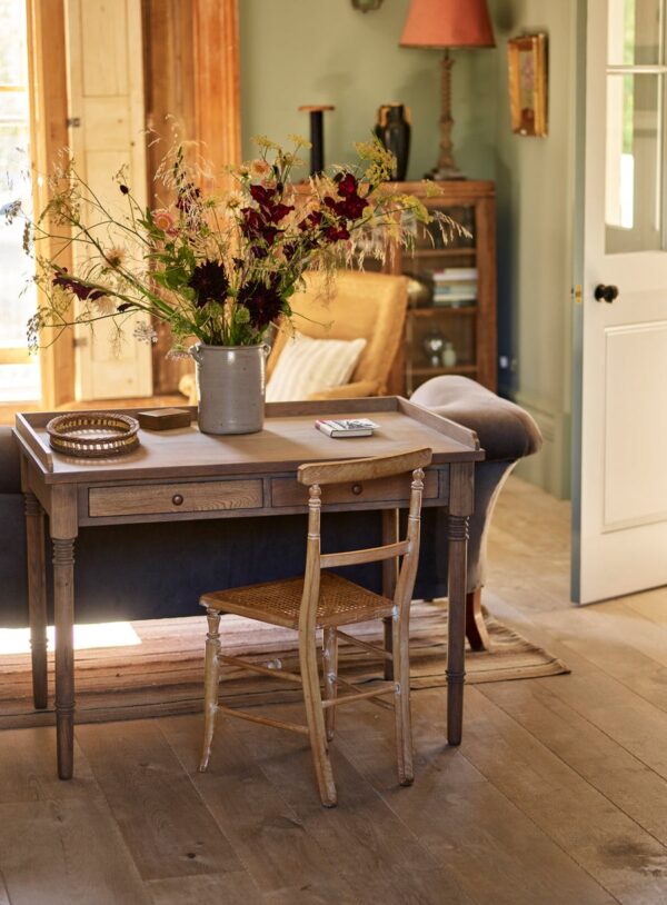 Antique-writing desk with drawer, hand-carved details, and aged oak oil finish