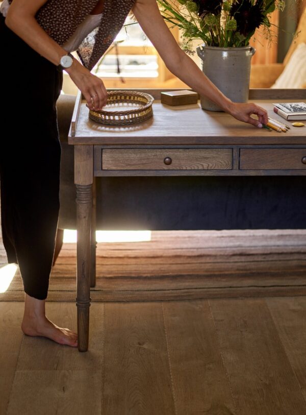 Antique-writing desk with drawer, hand-carved details, and aged oak oil finish