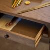 Antique-writing desk with drawer, hand-carved details, and aged oak oil finish