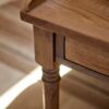 Antique-writing desk with drawer, hand-carved details, and aged oak oil finish