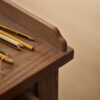 Antique-writing desk with drawer, hand-carved details, and aged oak oil finish