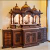 Large hand-carved teak wood temple with doors, bells, LED lighting, and spacious design for multiple idols