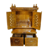 Small traditional wooden mandir in teak wood with natural finish for home worship