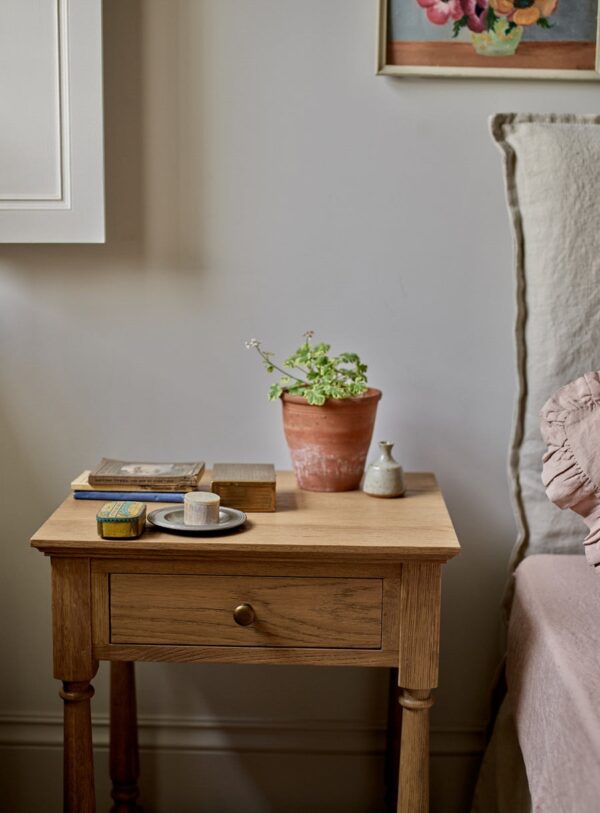 bedside table in natural pine wood with slim drawer, brass hardware, and bottom shelf