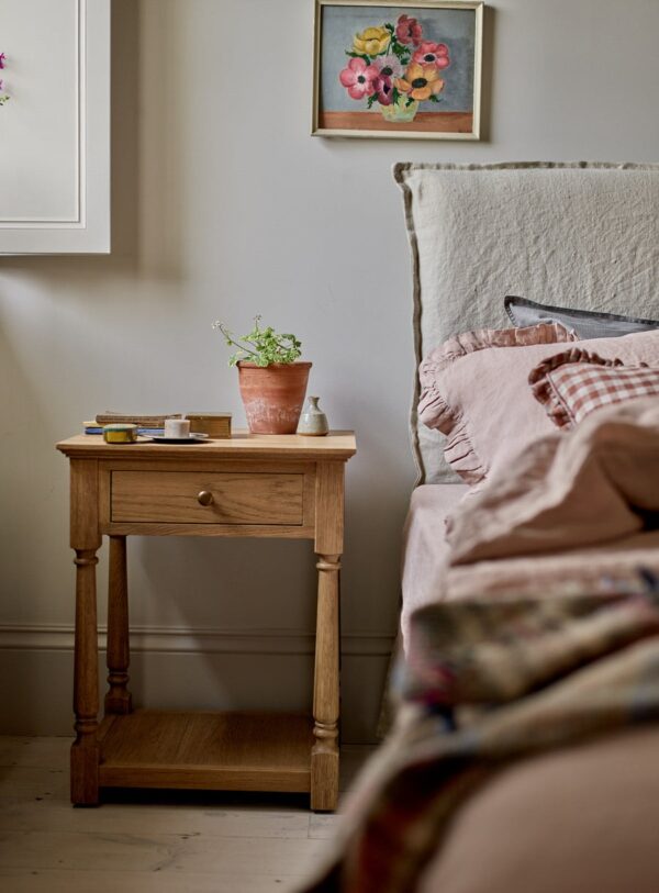 bedside table in natural pine wood with slim drawer, brass hardware, and bottom shelf