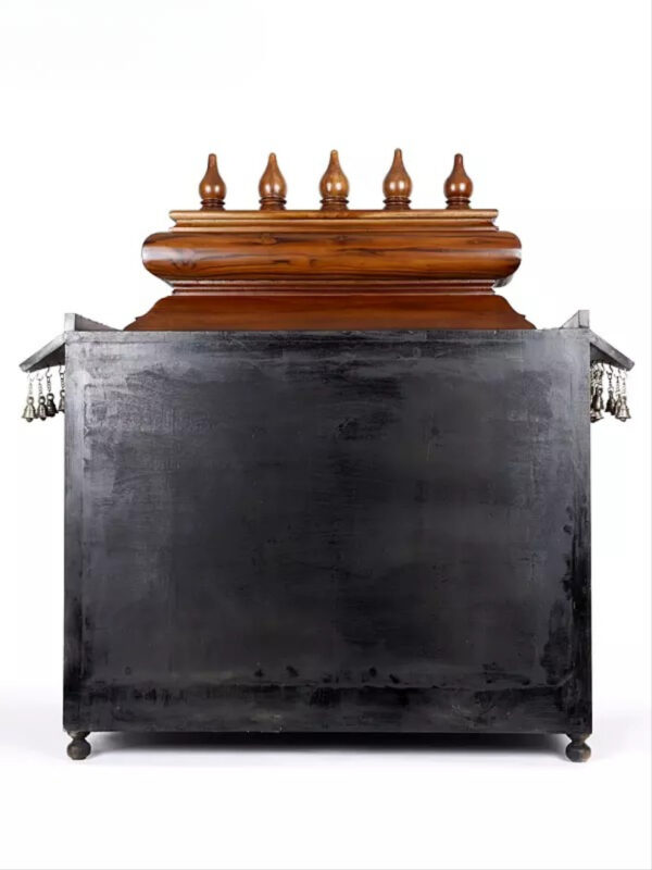 puja temple in dark brown finish with detailed carvings and dangling brass bells