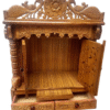 Handcrafted teak wood pooja mandir with peacock carving and doors, high gloss finish