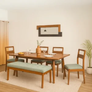 Teak wood dining table set with 4 chairs and 1 bench in brown finish and green cushioned seats.