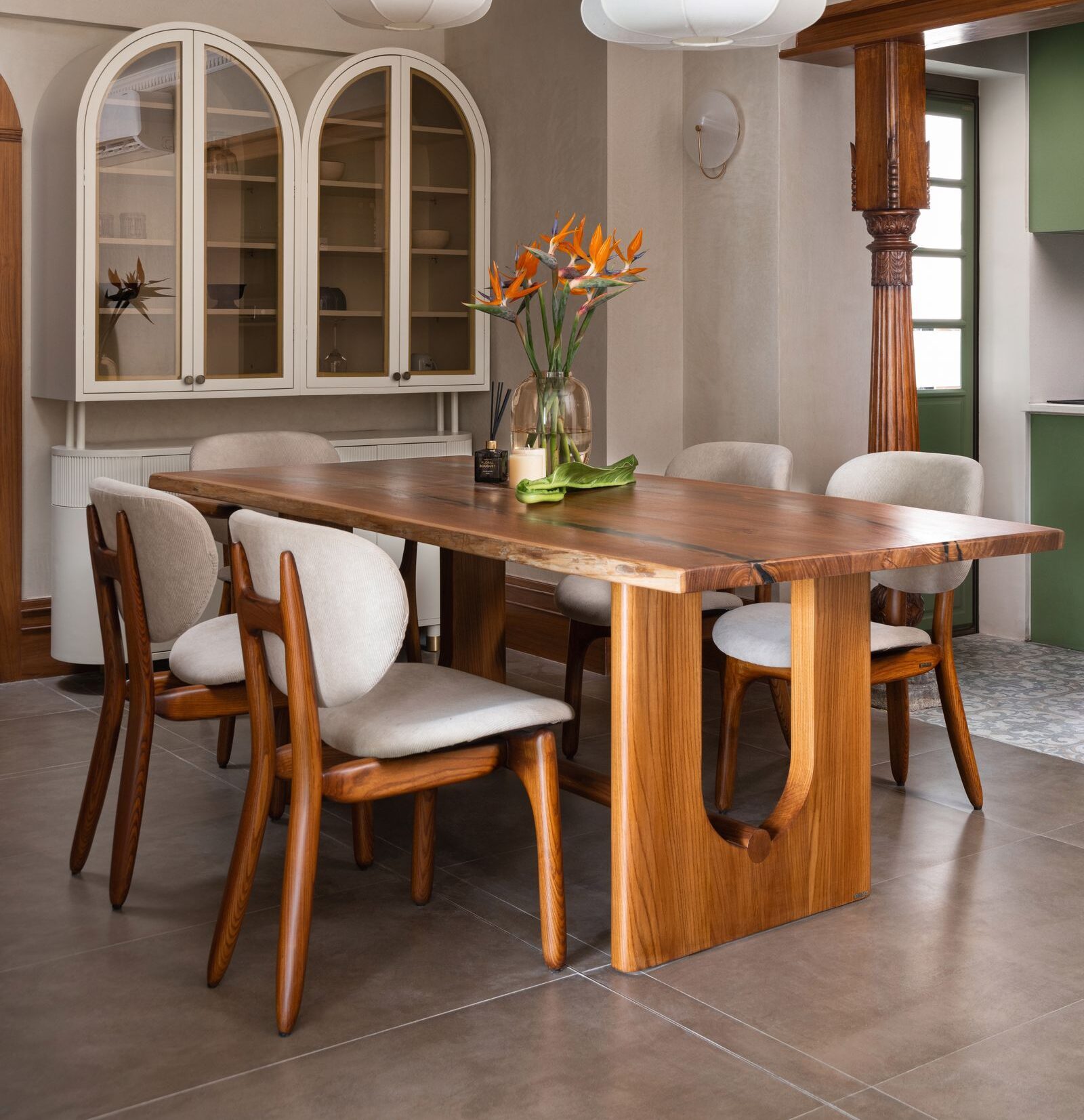 Luxury Dining Set with 6 upholstered chairs and solid teak wood table in modern dining room interior.
