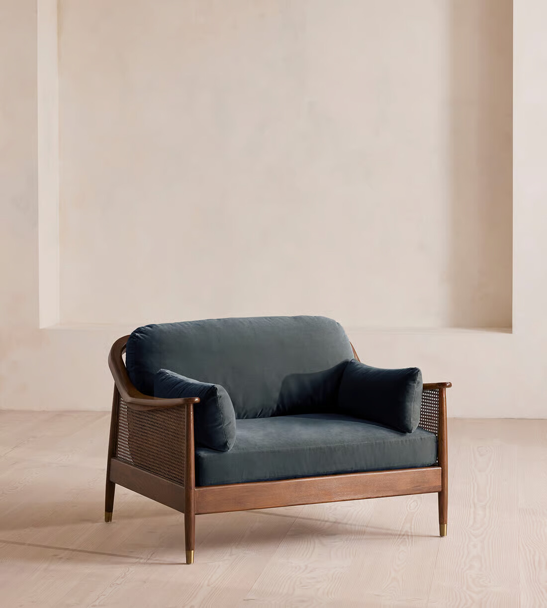 loveseat Sofa with cane sides, velvet upholstery, and 2 side pillows