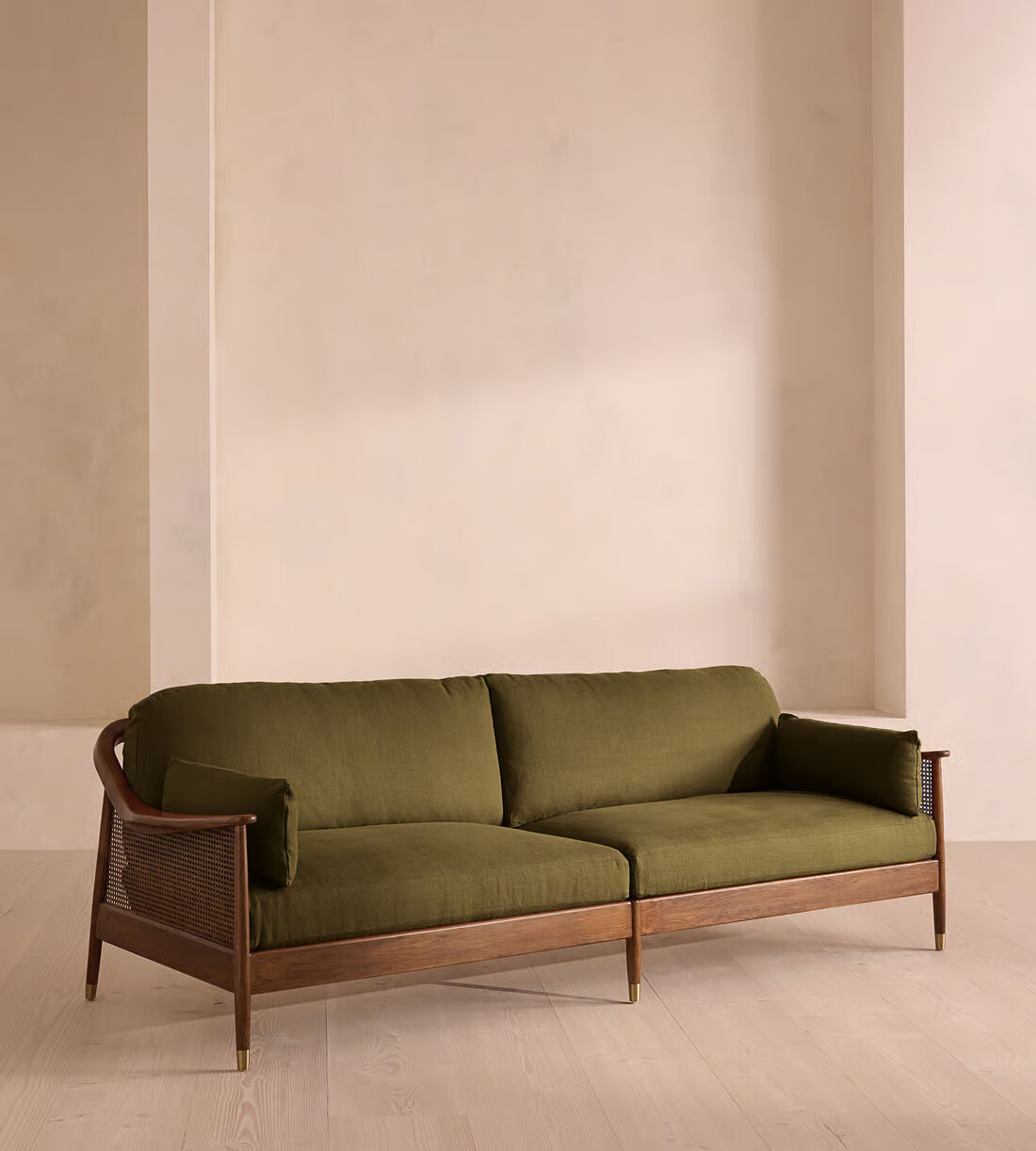 3 seater sofa with teak wood frame, cane sides, and linen upholstery with side pillows