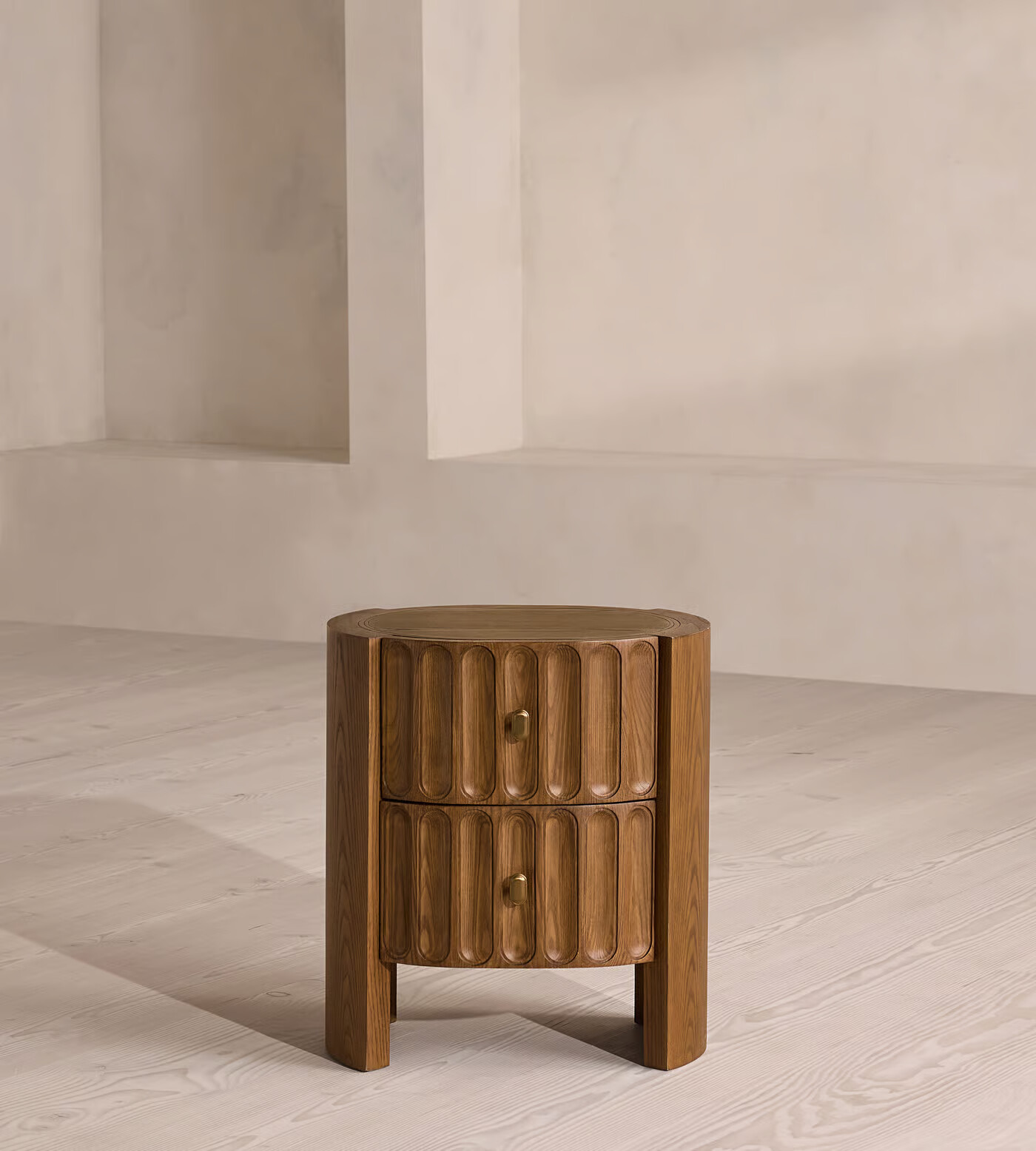 Night stand table with drawer in antique brass finish and pill-shaped grooves Night stand table with drawer in antique brass finish and pill-shaped grooves