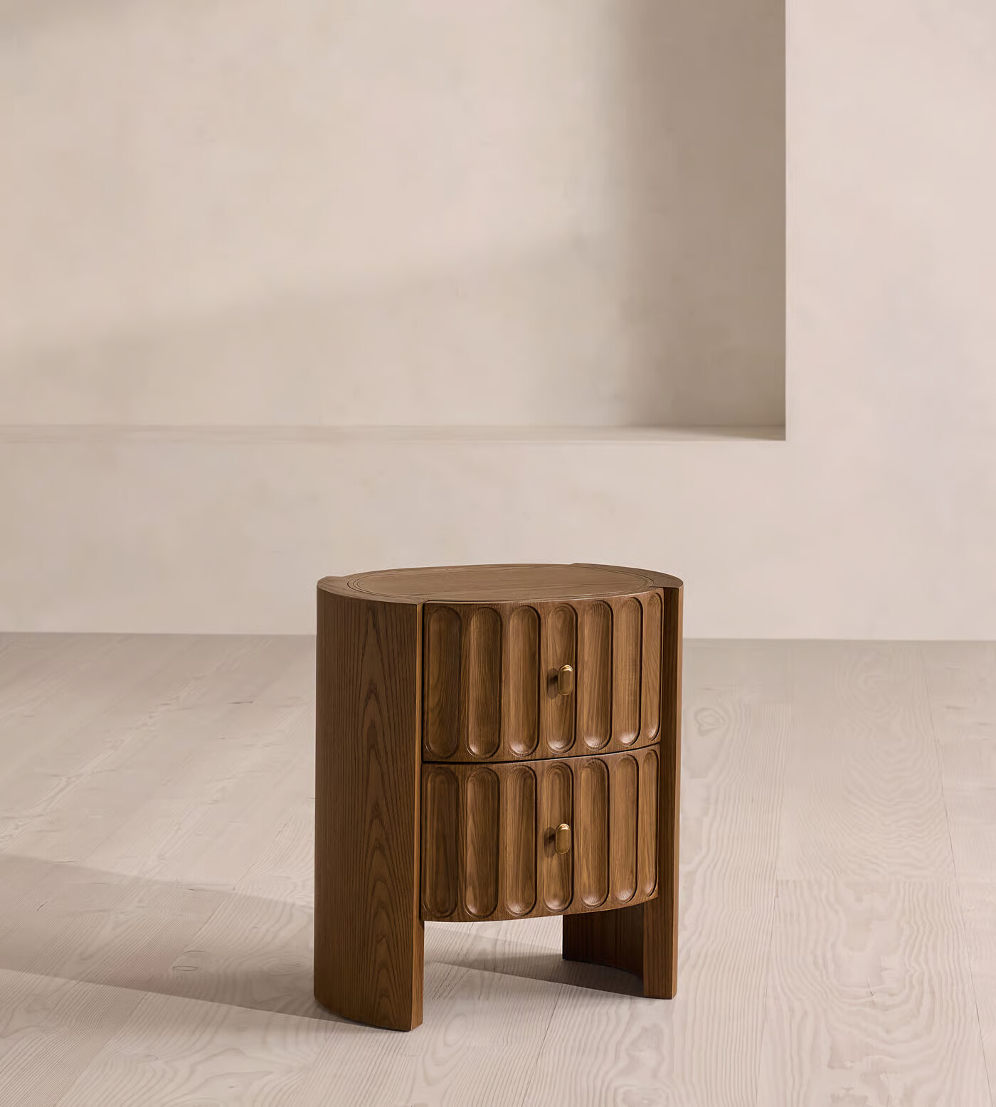 Night stand table with drawer in antique brass finish and pill-shaped grooves
