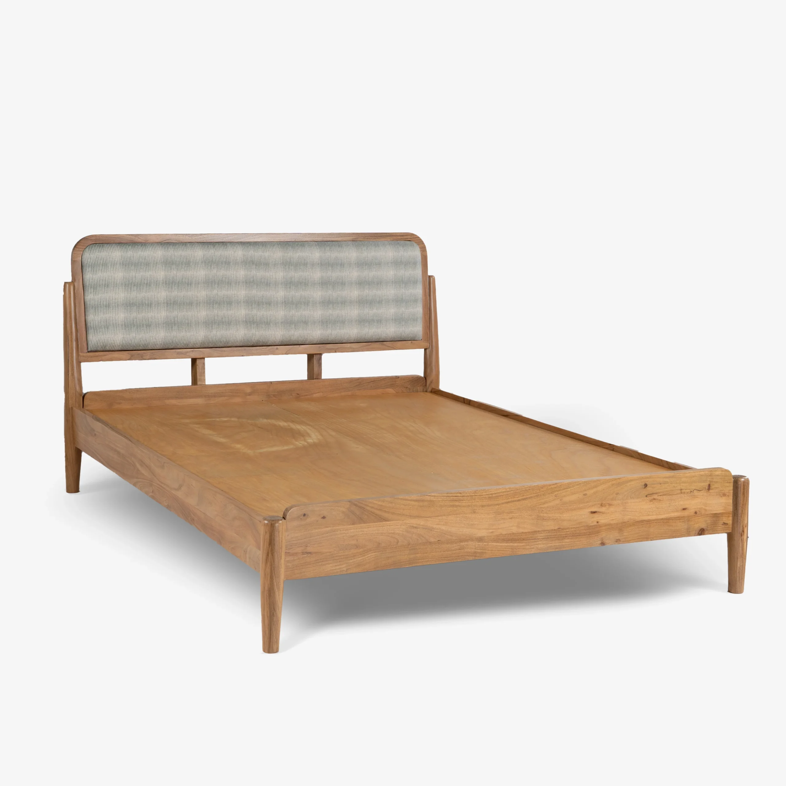 Queen size bed made of solid teak wood in natural finish with upholstered headboard — stylish and durable wooden bed for modern bedrooms. Queen size bed made of solid teak wood in natural finish with upholstered headboard — stylish and durable wooden bed for modern bedrooms.
