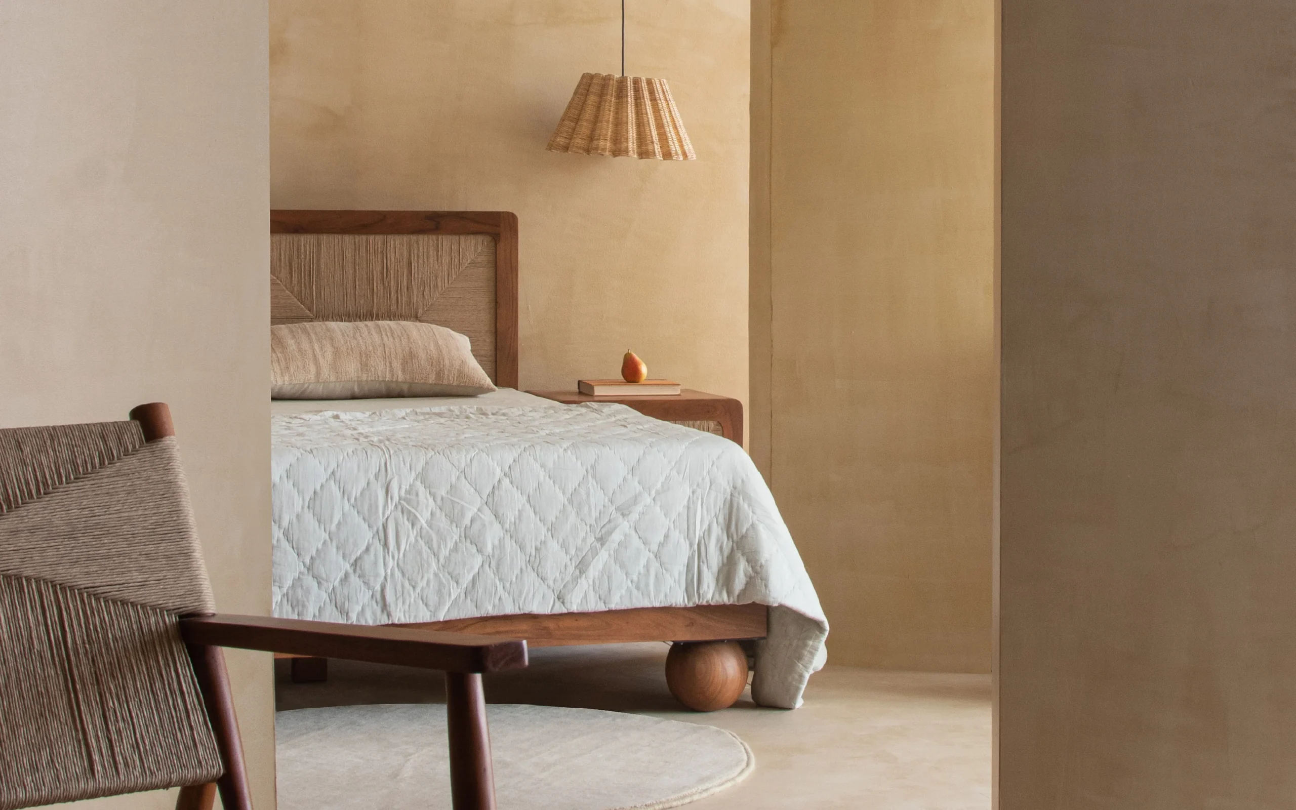 Queen size bed made of solid teak wood in natural finish with upholstered headboard — stylish and durable wooden bed for modern bedrooms. Queen size bed made of solid teak wood in natural finish with upholstered headboard — stylish and durable wooden bed for modern bedrooms.