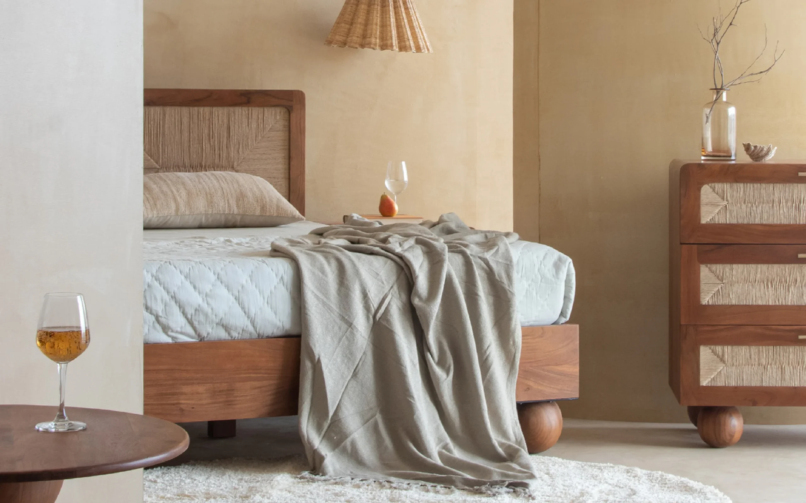 Queen size bed made of solid teak wood in natural finish with upholstered headboard — stylish and durable wooden bed for modern bedrooms. Queen size bed made of solid teak wood in natural finish with upholstered headboard — stylish and durable wooden bed for modern bedrooms.