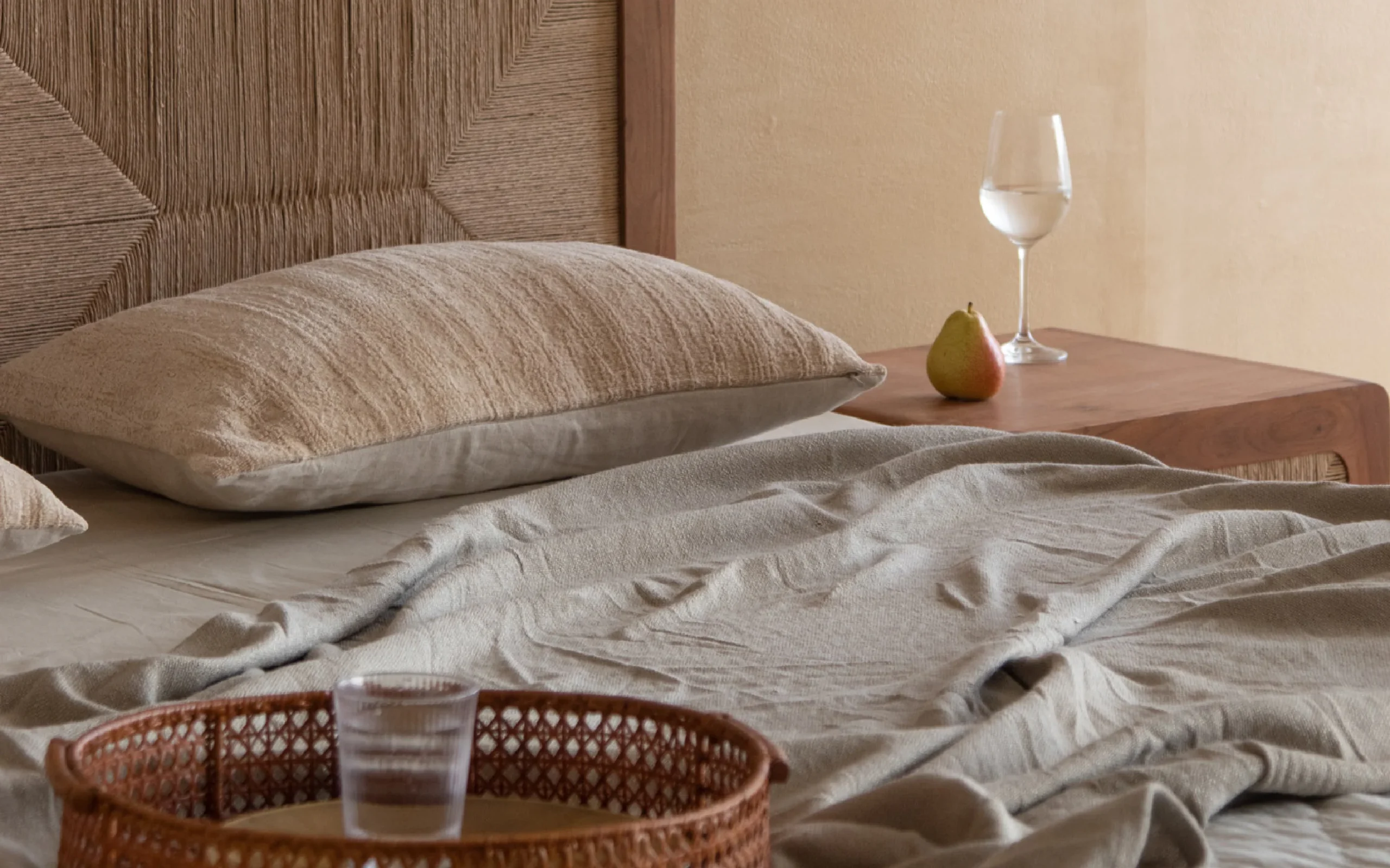 Queen size bed made of solid teak wood in natural finish with upholstered headboard — stylish and durable wooden bed for modern bedrooms. Queen size bed made of solid teak wood in natural finish with upholstered headboard — stylish and durable wooden bed for modern bedrooms.