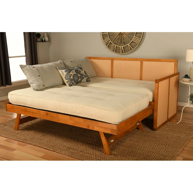 Cane sofa cum bed with teak wood frame, cane weaving, and trundle bed