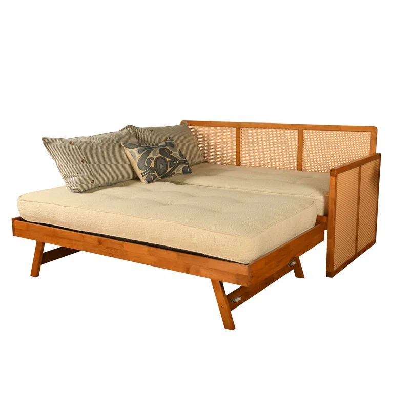 Cane sofa cum bed with teak wood frame, cane weaving, and trundle bed Cane sofa cum bed with teak wood frame, cane weaving, and trundle bed