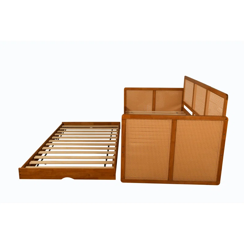 Cane sofa cum bed with teak wood frame, cane weaving, and trundle bed Cane sofa cum bed with teak wood frame, cane weaving, and trundle bed