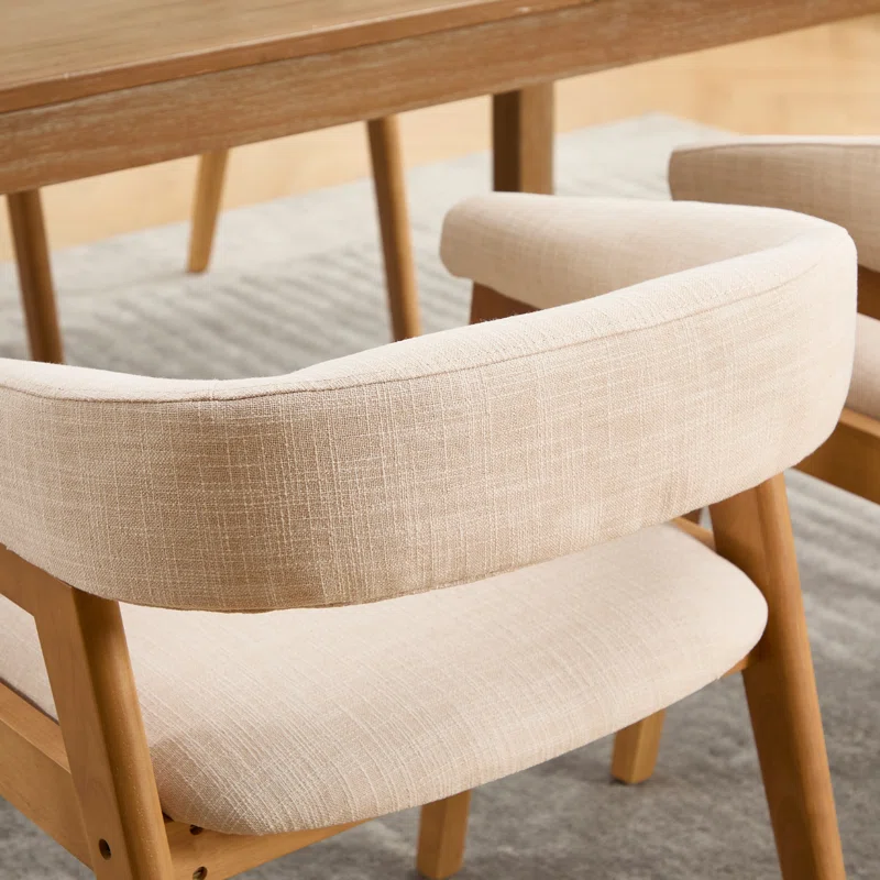 Modern dining chairs with curved backrest and upholstered seat Modern dining chairs with curved backrest and upholstered seat