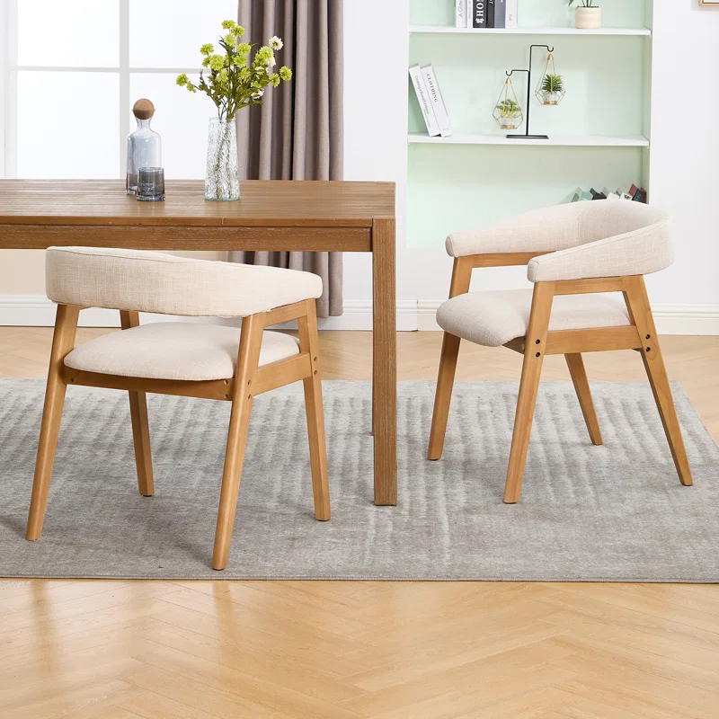 Modern dining chairs with curved backrest and upholstered seat Modern dining chairs with curved backrest and upholstered seat