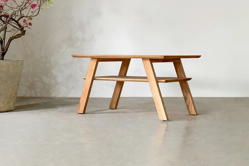 Simple coffee table in solid teak wood with natural brown finish