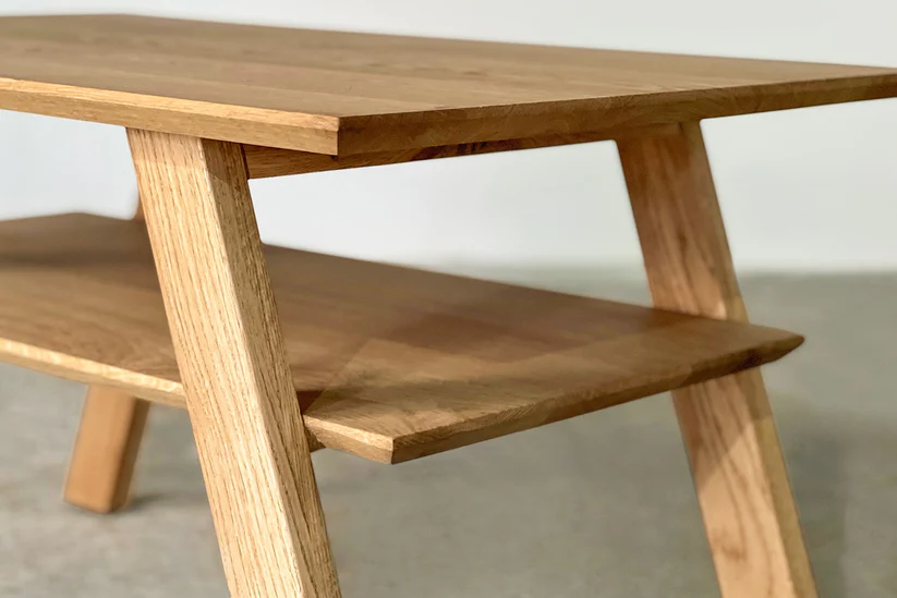 Simple coffee table in solid teak wood with natural brown finish Simple coffee table in solid teak wood with natural brown finish
