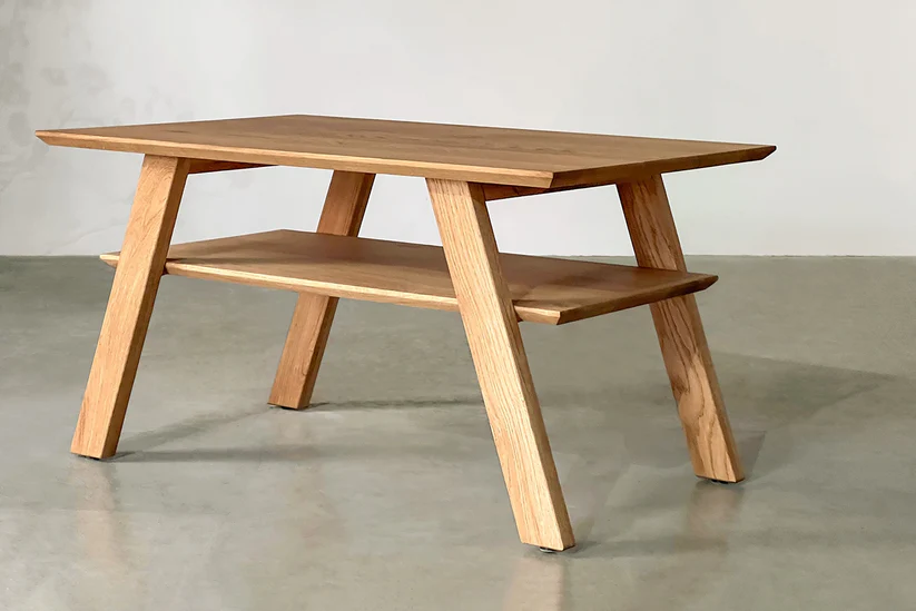 Simple coffee table in solid teak wood with natural brown finish Simple coffee table in solid teak wood with natural brown finish