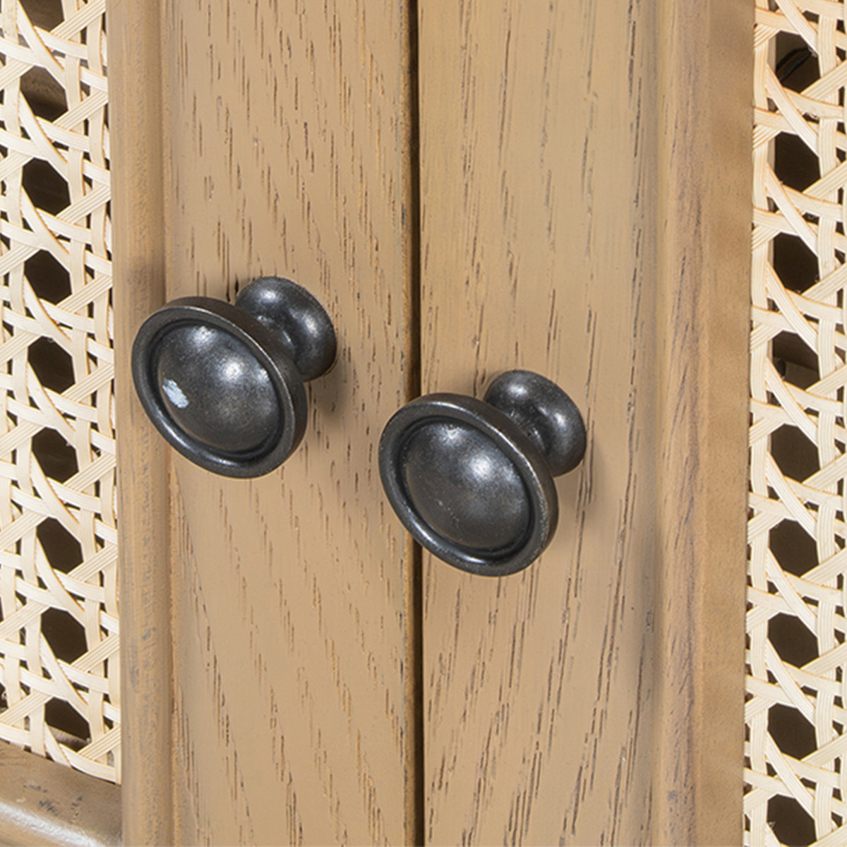 Teak wood shoe bench with natural cane cushion and two storage doors, shown in a modern entryway.
