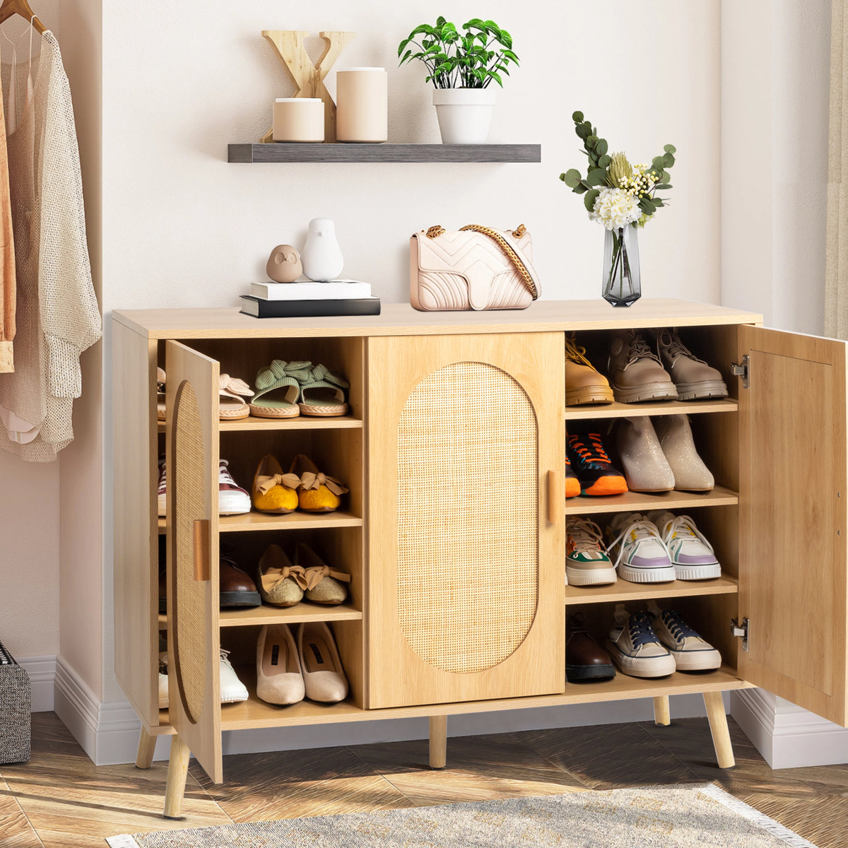 Bohemian style freestanding shoe cabinet with natural rattan veneer and teak wood frame, showing eight storage compartments.