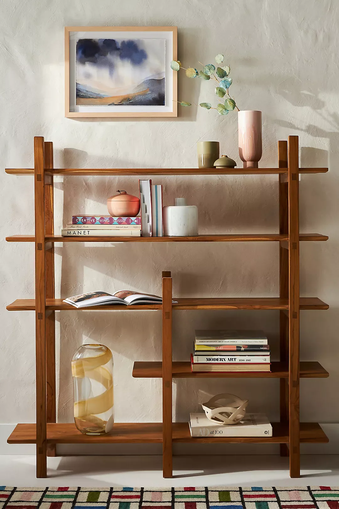 Wooden bookshelf in solid teak wood with five shelves and natural brown finish Wooden bookshelf in solid teak wood with five shelves and natural brown finish