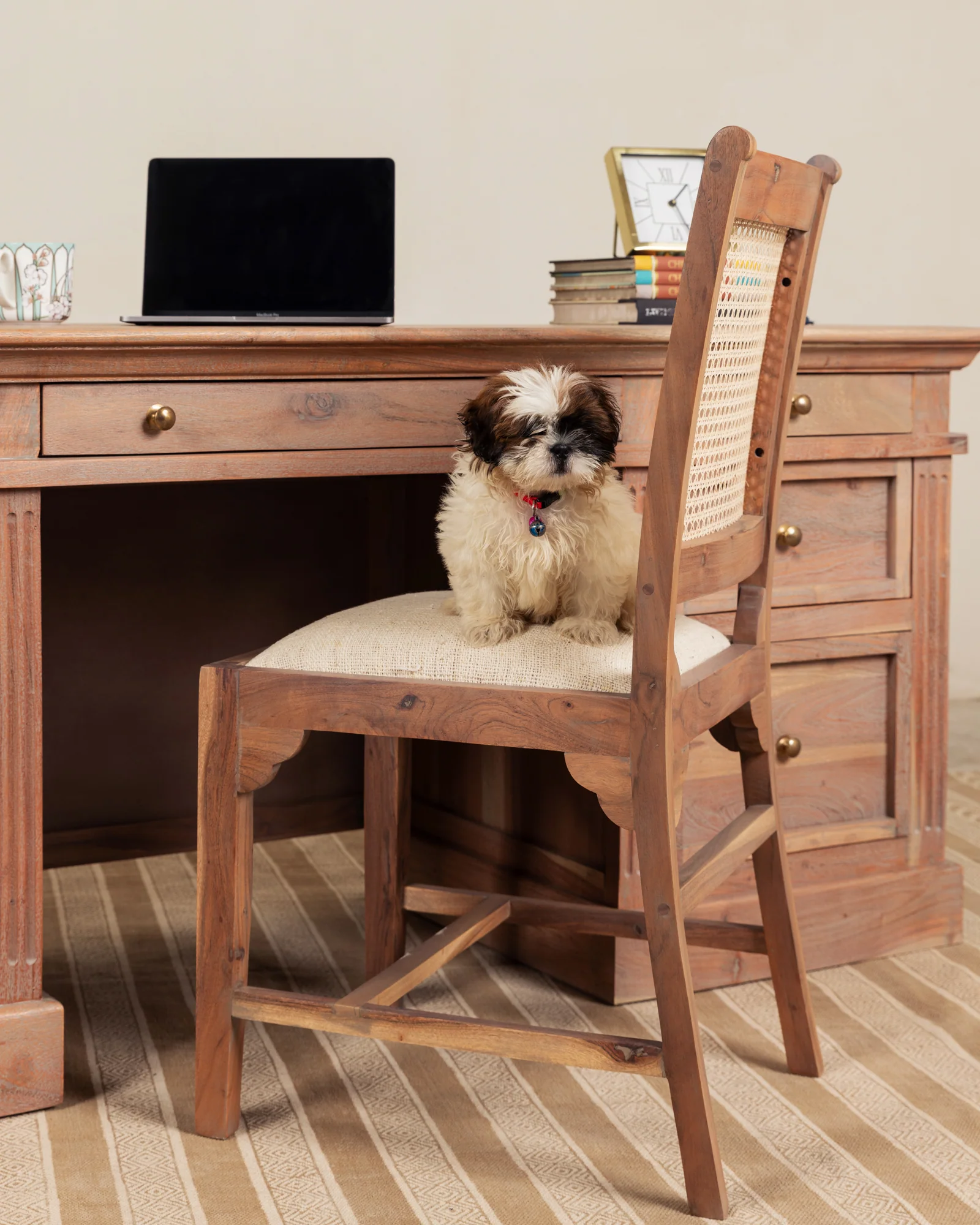 Wooden writing desk in solid teak wood with seven drawers and natural brown finish