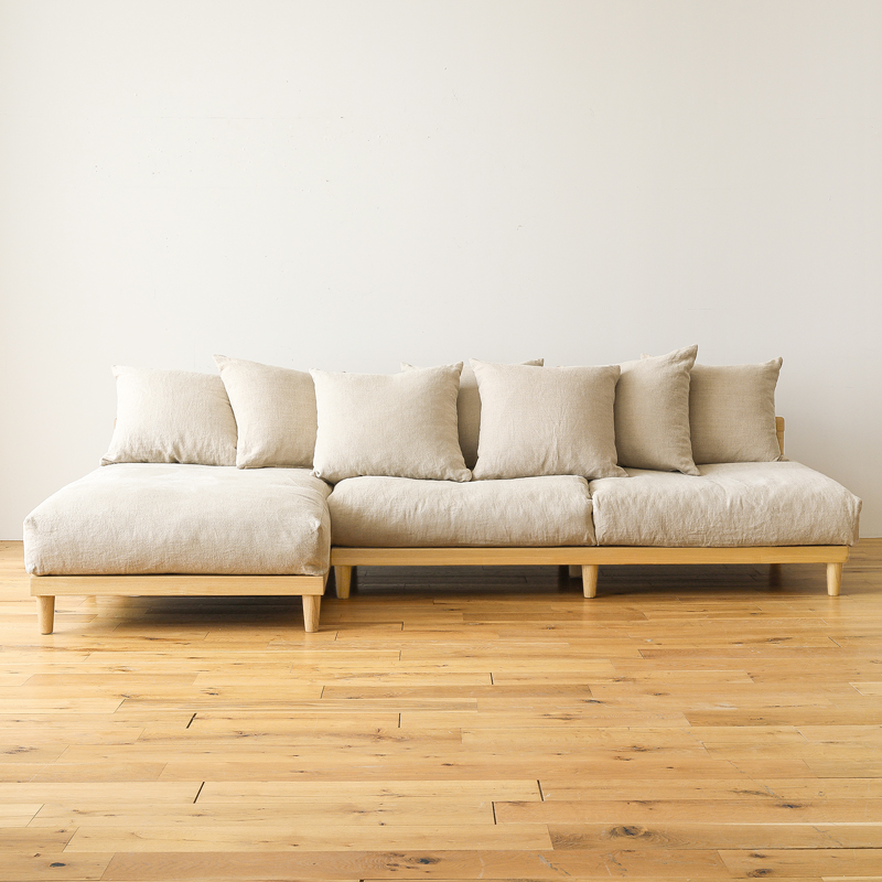L shaped sofa in teak wood with cotton canvas cushions